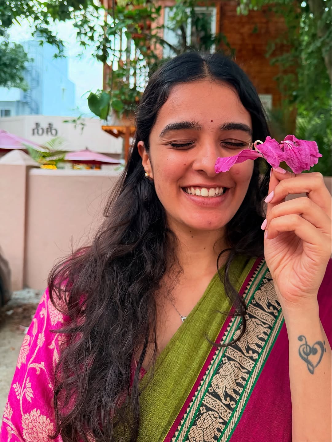 A pink saree in afternoon light
